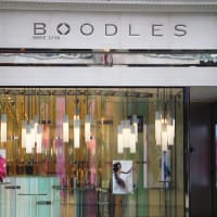 Outside view of a store front illuminated by LED bulbs in the window.
