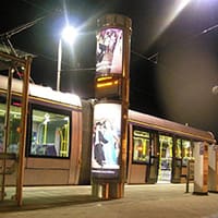 LED lighting installation at a LUAS light rail station, showcasing a modern and well-lit platform area. The image highlights the clean lines and bright illumination provided by the LED fixtures, enhancing safety and visibility for passengers.